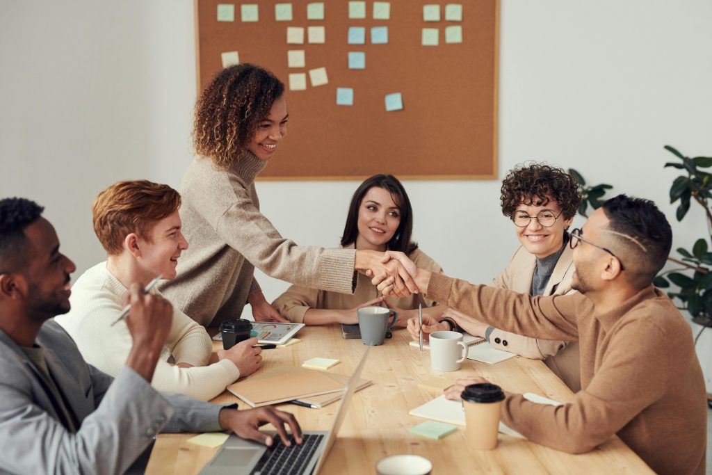 pexels photo 3184291 3184291 1 Diverse team collaborating in a meeting, showcasing teamwork and cooperation in a modern workplace.